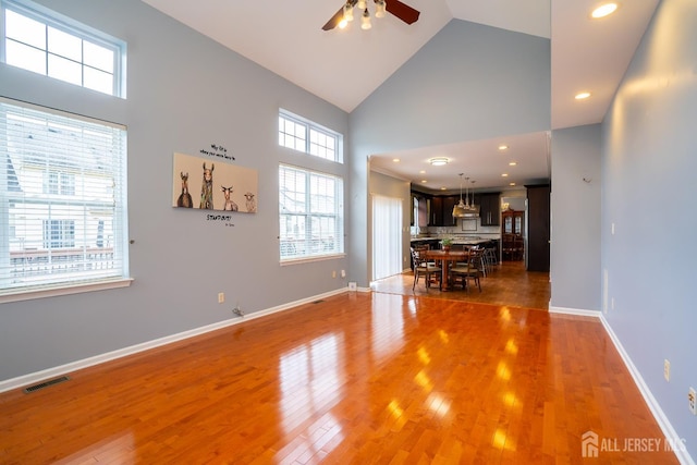 4 Bernadette Cir S, Brunswick, NJ 08852 - living room with high vaulted ceiling, a ceiling fan, light wood-type flooring, baseboards, and recessed lighting