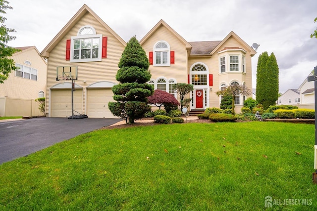 4 Bernadette Cir S, Brunswick, NJ 08852 - view of front of house with an attached garage, driveway, and a front lawn