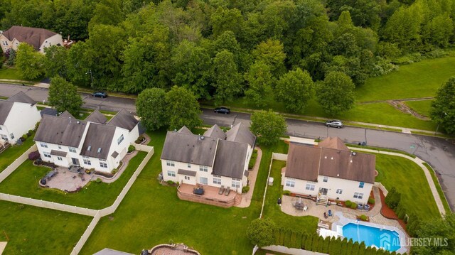 4 Bernadette Cir S, Brunswick, NJ 08852 - aerial view of residential area with a pool and a forest