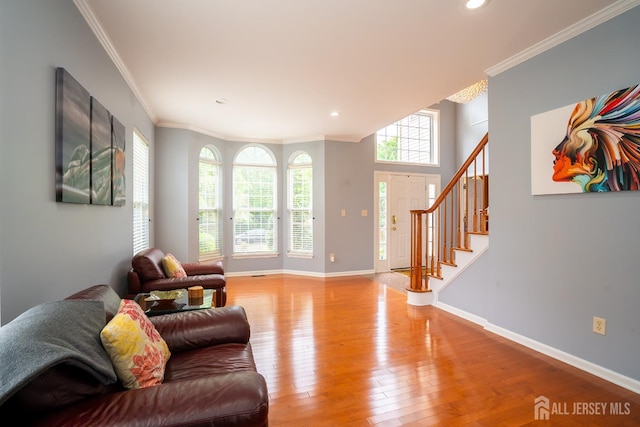 4 Bernadette Cir S, Brunswick, NJ 08852 - living area featuring light wood finished floors, crown molding, baseboards, recessed lighting, and stairs