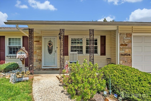 13 Sheffield Ave, Monroe, NJ 08831 - doorway to property featuring a porch, stone siding, and a garage