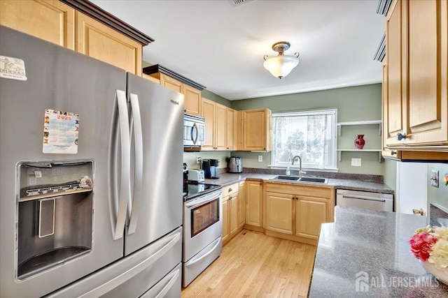 13 Sheffield Ave, Monroe, NJ 08831 - kitchen with stainless steel appliances, a sink, light brown cabinets, light wood-style flooring, and dark countertops