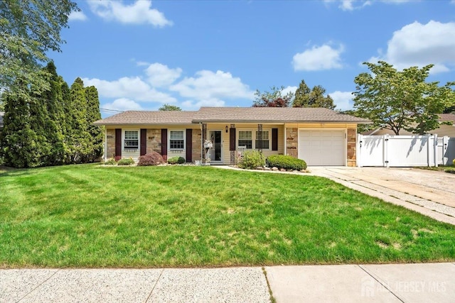 13 Sheffield Ave, Monroe, NJ 08831 - ranch-style home featuring a garage, driveway, stone siding, and a gate
