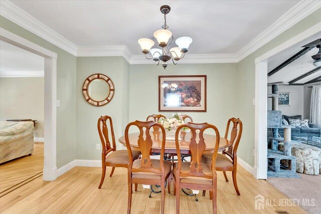 13 Sheffield Ave, Monroe, NJ 08831 - dining space featuring a chandelier, light wood-style flooring, baseboards, and crown molding