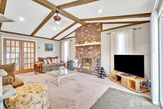 13 Sheffield Ave, Monroe, NJ 08831 - carpeted living area featuring french doors, healthy amount of natural light, tile patterned floors, a brick fireplace, and recessed lighting