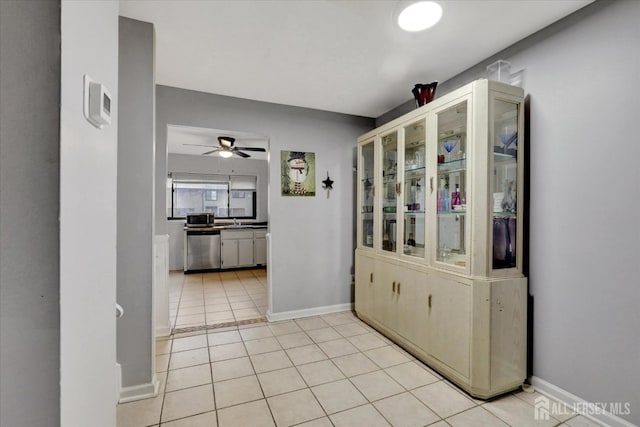 186 Hamilton Pl, East Windsor, NJ 08520 - unfurnished dining area with ceiling fan, baseboards, and light tile patterned floors