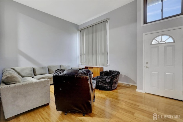 186 Hamilton Pl, East Windsor, NJ 08520 - living room featuring light wood-style floors and baseboards