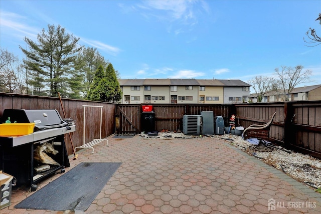 186 Hamilton Pl, East Windsor, NJ 08520 - fenced backyard featuring cooling unit, a patio area, grilling area, a residential view, and a gate