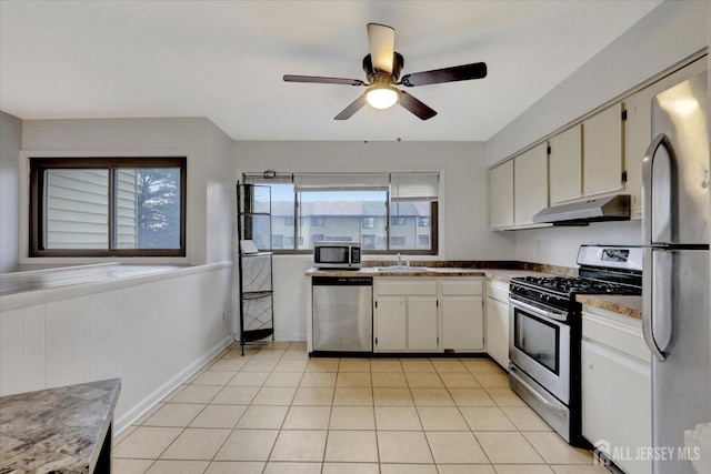186 Hamilton Pl, East Windsor, NJ 08520 - kitchen featuring stainless steel appliances, under cabinet range hood, a ceiling fan, a sink, and light tile patterned floors