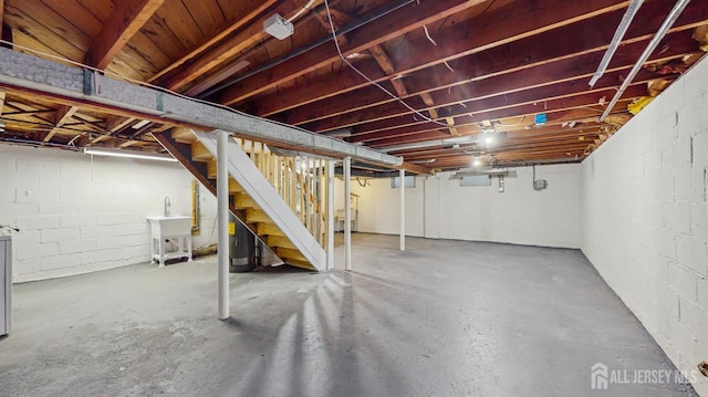 13 Prospect St, Metuchen, NJ 08840 - unfinished basement featuring stairs and concrete block wall