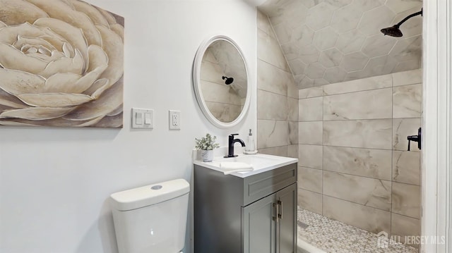 13 Prospect St, Metuchen, NJ 08840 - bathroom with lofted ceiling, tiled shower, toilet, and vanity