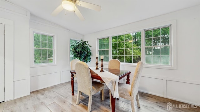 13 Prospect St, Metuchen, NJ 08840 - dining space featuring vaulted ceiling, a decorative wall, light wood-style floors, and a ceiling fan