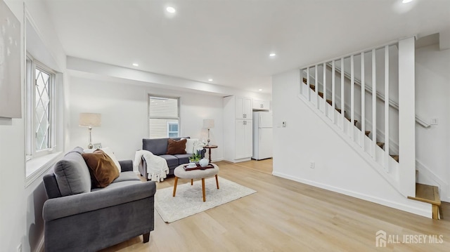 13 Prospect St, Metuchen, NJ 08840 - living area with stairs, light wood-style floors, recessed lighting, and baseboards
