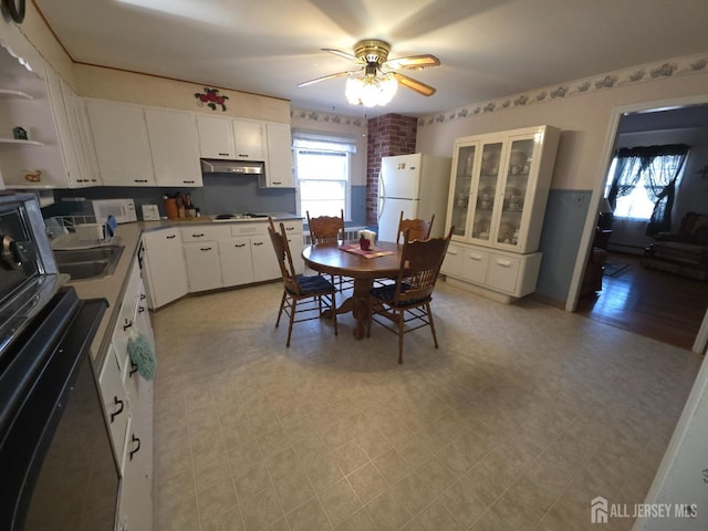 144 Buckelew Ave, Jamesburg, NJ 08831 - dining space featuring a ceiling fan and light floors