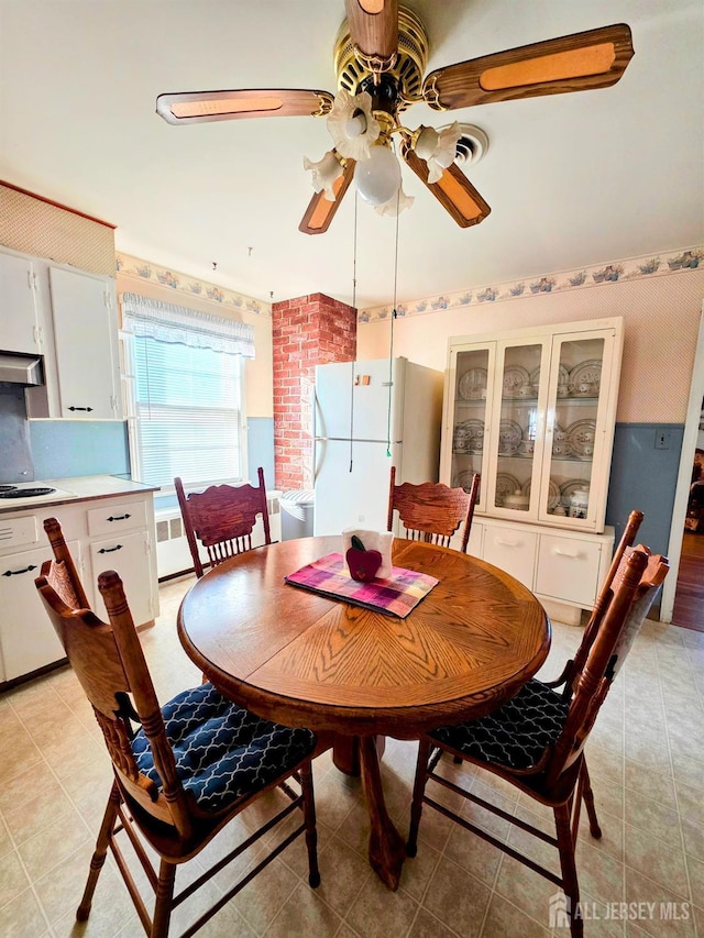 144 Buckelew Ave, Jamesburg, NJ 08831 - dining area with ceiling fan and light tile patterned floors