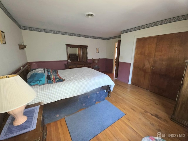 144 Buckelew Ave, Jamesburg, NJ 08831 - bedroom with wood finished floors and a closet