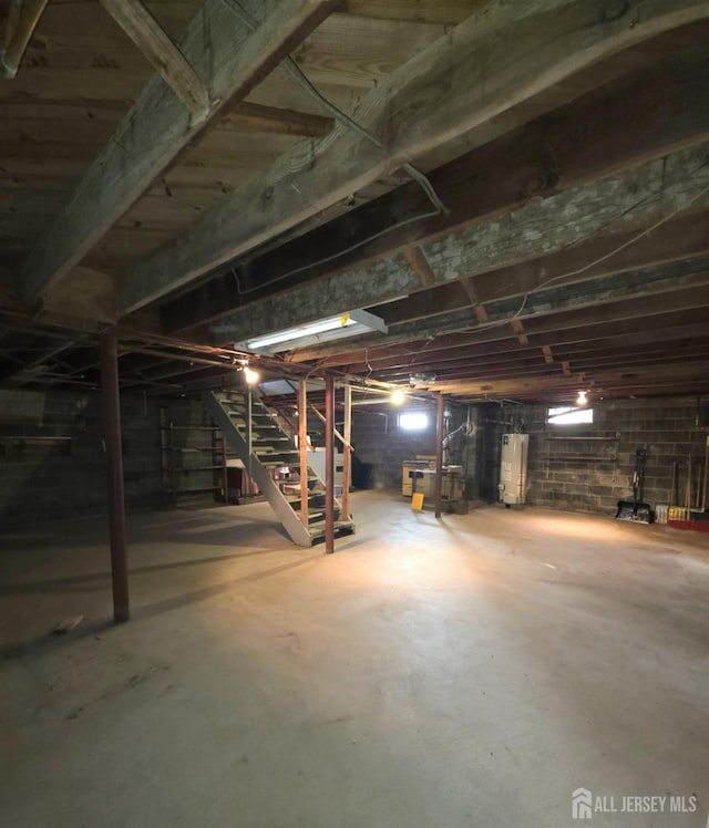 144 Buckelew Ave, Jamesburg, NJ 08831 - unfinished basement featuring water heater and stairway
