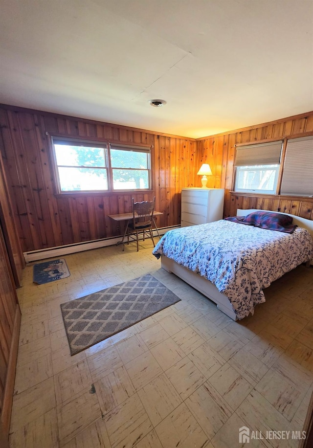 144 Buckelew Ave, Jamesburg, NJ 08831 - bedroom featuring light flooring, wooden walls, and baseboard heating
