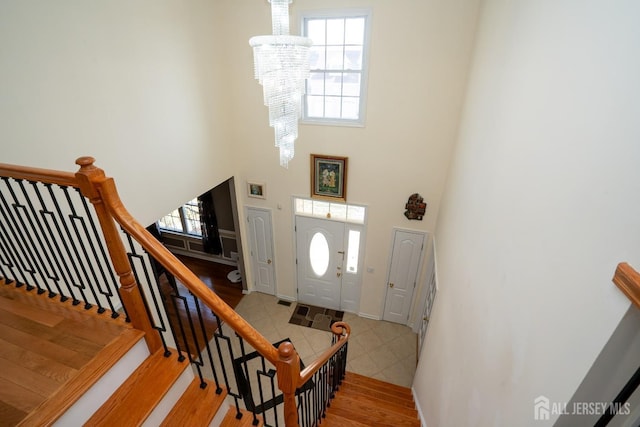 45 Green Ash St, Monroe, NJ 08831 - foyer entrance with a chandelier, a high ceiling, plenty of natural light, light wood-type flooring, and stairway