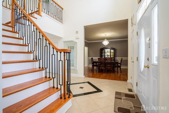 45 Green Ash St, Monroe, NJ 08831 - entryway with inlaid floor details, tile patterned floors, stairway, ornamental molding, and baseboards