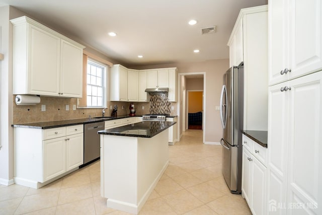 45 Green Ash St, Monroe, NJ 08831 - kitchen with stainless steel appliances, decorative backsplash, a center island, white cabinets, and dark stone countertops