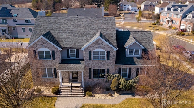 45 Green Ash St, Monroe, NJ 08831 - traditional-style house featuring a residential view, brick siding, and roof with shingles