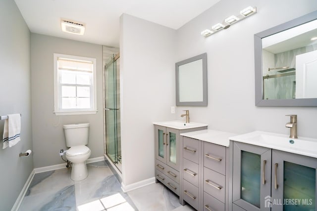 45 Green Ash St, Monroe, NJ 08831 - bathroom featuring a stall shower, toilet, marble look tile flooring, baseboards, and vanity