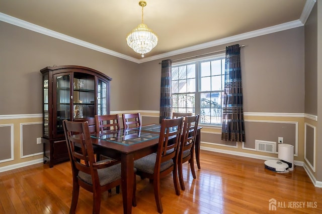 45 Green Ash St, Monroe, NJ 08831 - dining room with a chandelier, light wood finished floors, ornamental molding, and baseboards