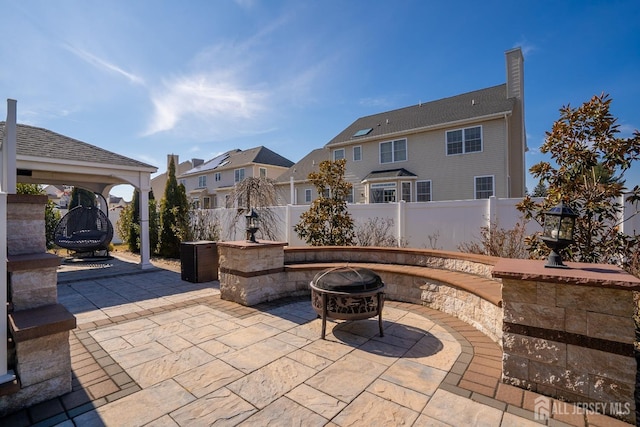 45 Green Ash St, Monroe, NJ 08831 - view of patio / terrace featuring an outdoor fire pit, a residential view, a gazebo, and fence