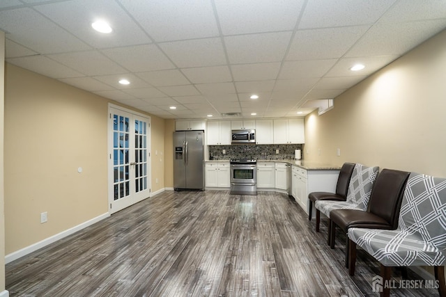 45 Green Ash St, Monroe, NJ 08831 - kitchen featuring appliances with stainless steel finishes, dark wood finished floors, baseboards, white cabinets, and recessed lighting