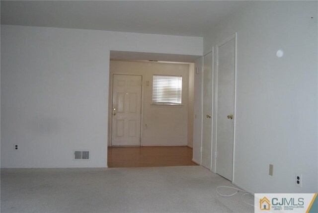 hallway featuring carpet floors