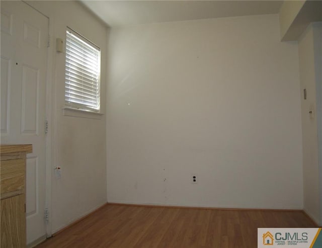 empty room featuring hardwood / wood-style flooring