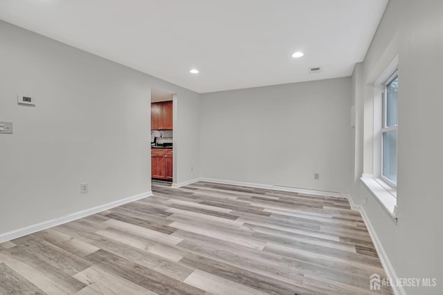 73 Doe Ct, South Brunswick, NJ 08852 - spare room featuring light wood-type flooring, plenty of natural light, baseboards, and recessed lighting