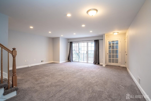 interior space featuring baseboards, visible vents, stairway, carpet floors, and recessed lighting