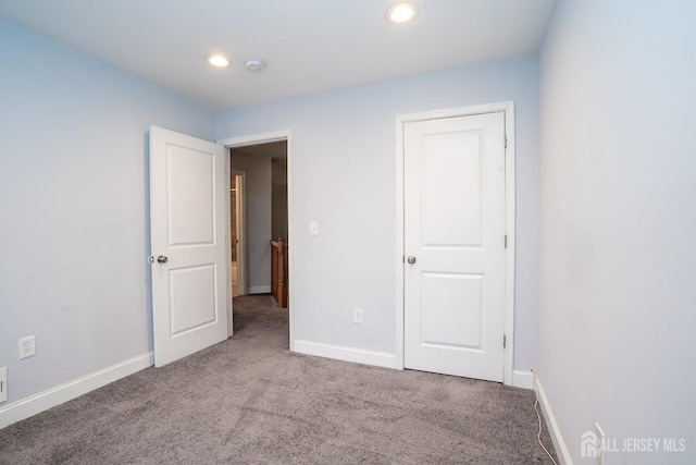 unfurnished bedroom with carpet floors, recessed lighting, and baseboards