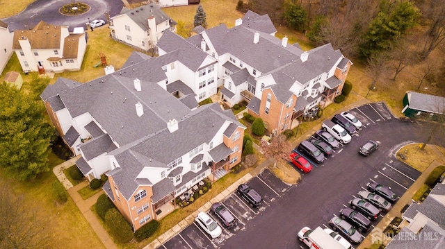 birds eye view of property with a residential view