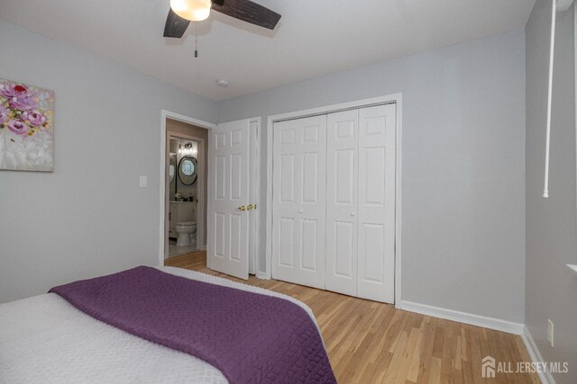 bedroom with ceiling fan, wood-type flooring, and a closet