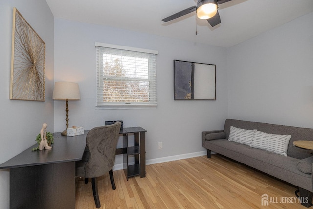 office featuring wood-type flooring and ceiling fan