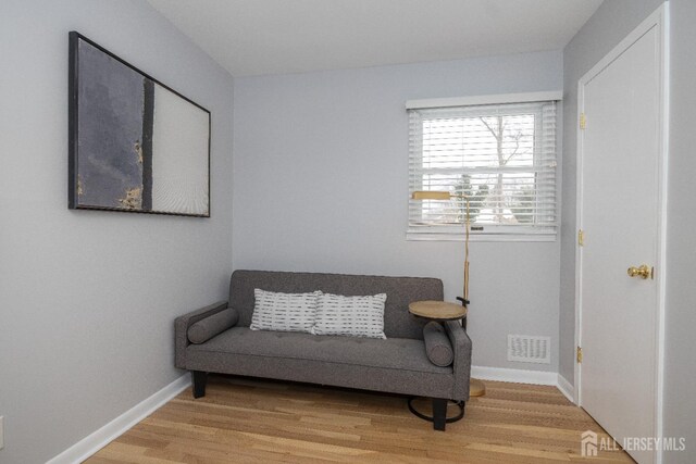 living area featuring hardwood / wood-style floors