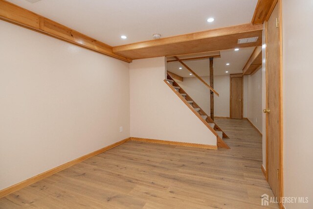 basement featuring light wood-type flooring