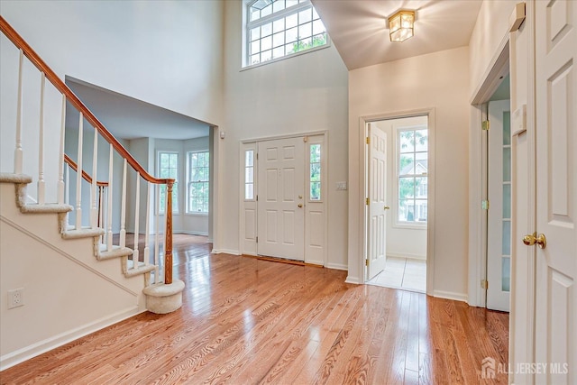 15 Fabiszewski Way, Parlin, NJ 08859 - foyer entrance featuring plenty of natural light, wood finished floors, stairway, baseboards, and a high ceiling
