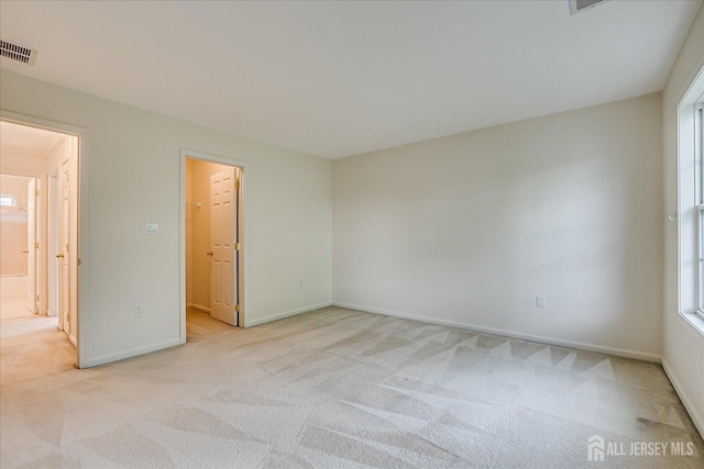 15 Fabiszewski Way, Parlin, NJ 08859 - unfurnished bedroom featuring light carpet, a walk in closet, baseboards, and multiple windows