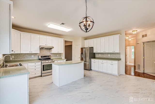 15 Fabiszewski Way, Parlin, NJ 08859 - kitchen with appliances with stainless steel finishes, a sink, under cabinet range hood, and light marble finish flooring