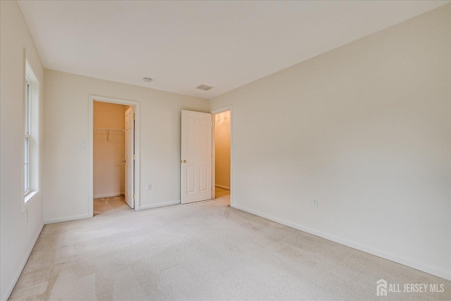 15 Fabiszewski Way, Parlin, NJ 08859 - unfurnished bedroom with light carpet, baseboards, a spacious closet, and a closet