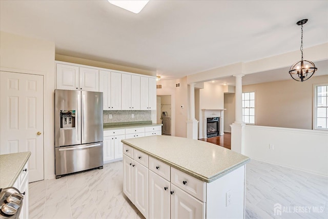 15 Fabiszewski Way, Parlin, NJ 08859 - kitchen featuring stainless steel refrigerator with ice dispenser, light countertops, white cabinetry, light marble finish floors, and a center island