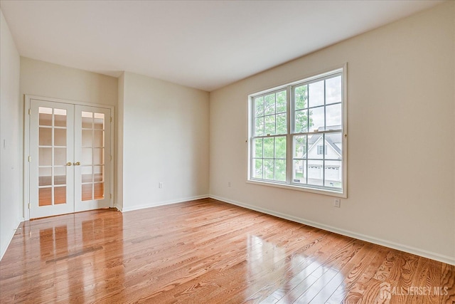 15 Fabiszewski Way, Parlin, NJ 08859 - empty room with french doors, wood finished floors, and baseboards