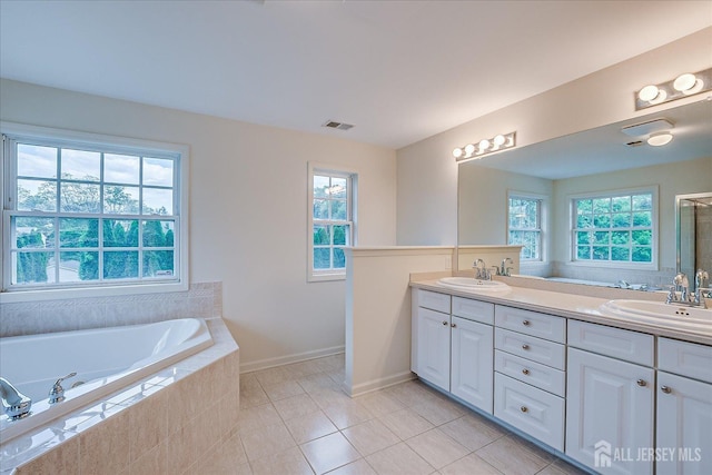 15 Fabiszewski Way, Parlin, NJ 08859 - bathroom with double vanity, a garden tub, healthy amount of natural light, and tile patterned floors