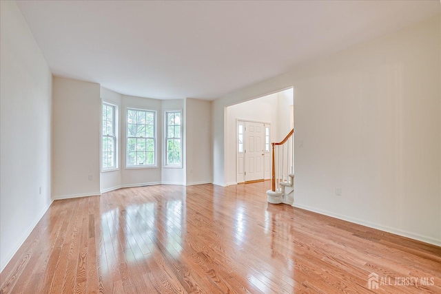 15 Fabiszewski Way, Parlin, NJ 08859 - spare room featuring light wood-style flooring, stairs, and baseboards