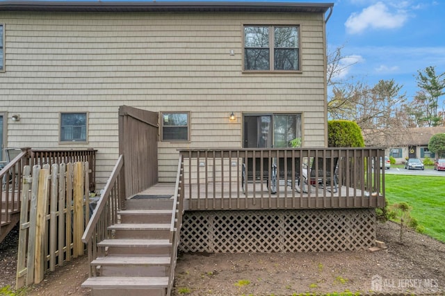 rear view of house with a deck and stairs