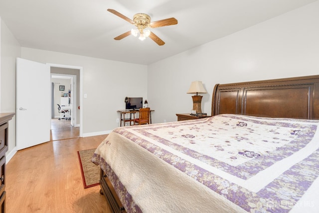 bedroom with light wood finished floors and a ceiling fan